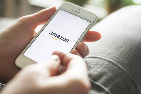 Person placing an Amazon order on a mobile device.